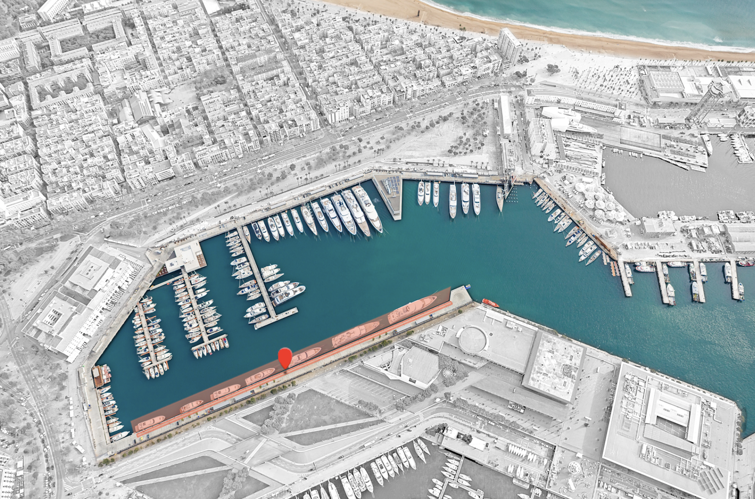 Aerial view of Marina Port Vell in Barcelona with numerous yachts docked along the piers.