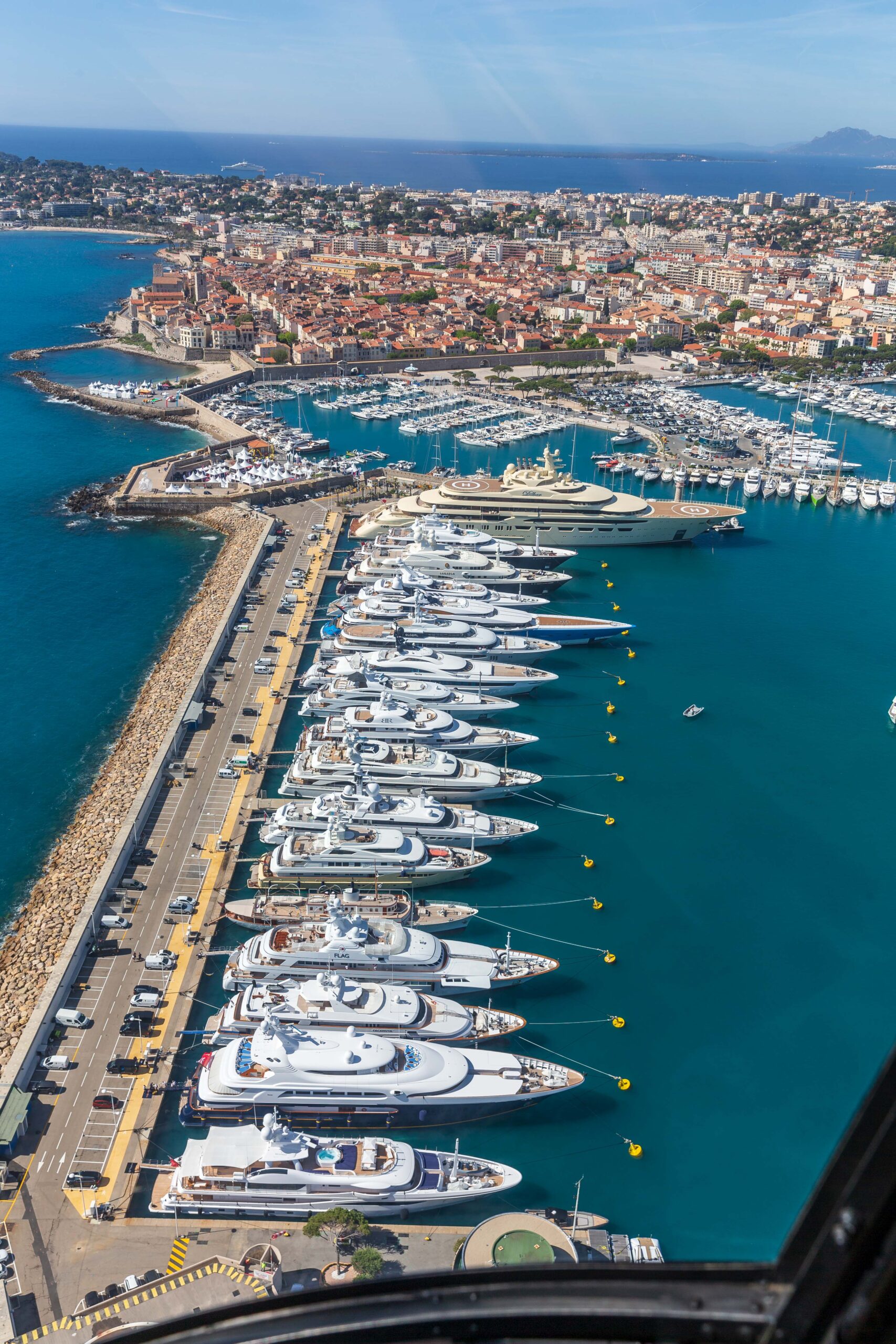 Aerial view of a marina filled with luxury yachts docked along the pier in Photo-7.