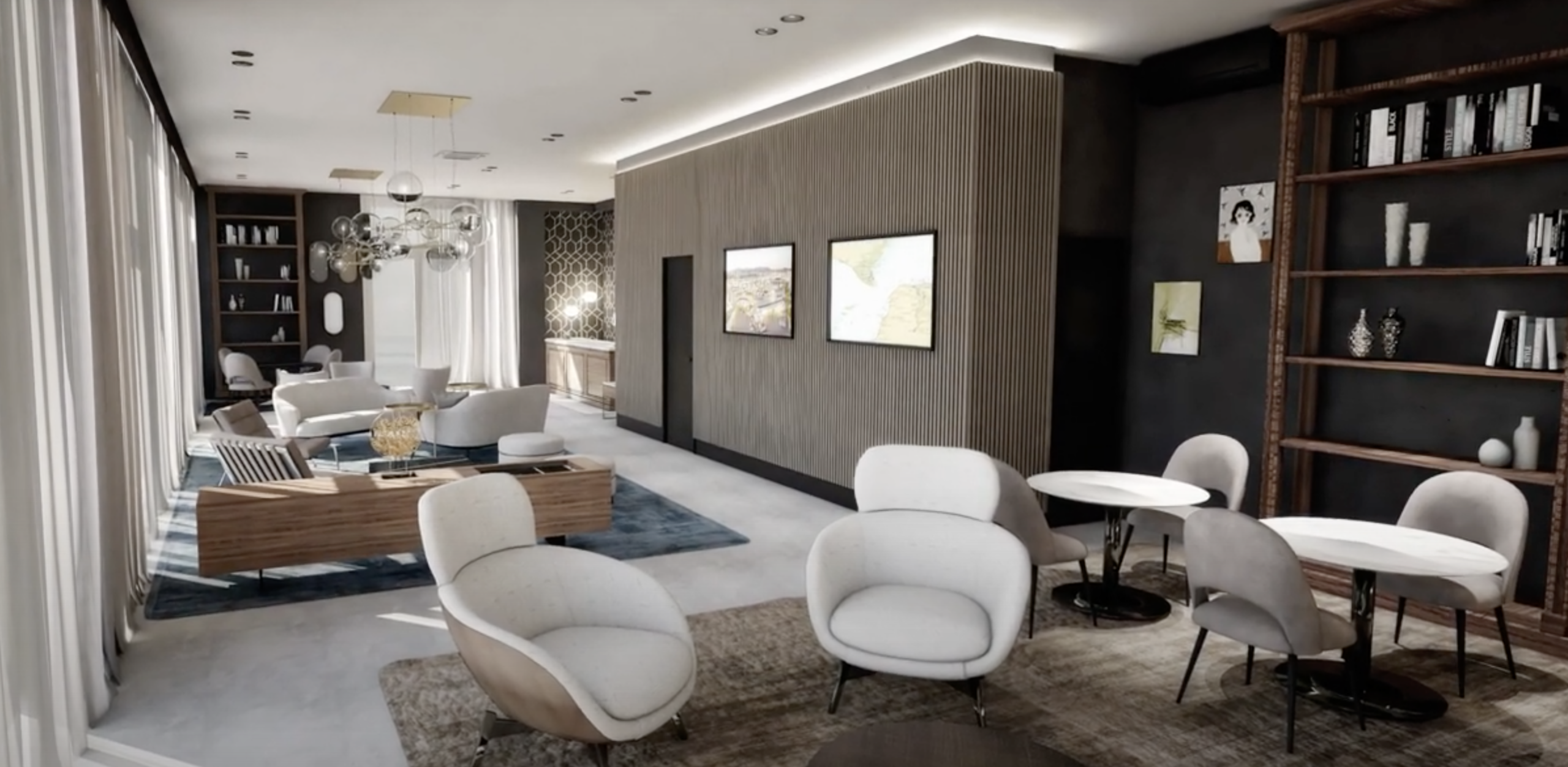 Modern lounge with elegant seating areas, bookshelves, and large windows with sheer curtains.