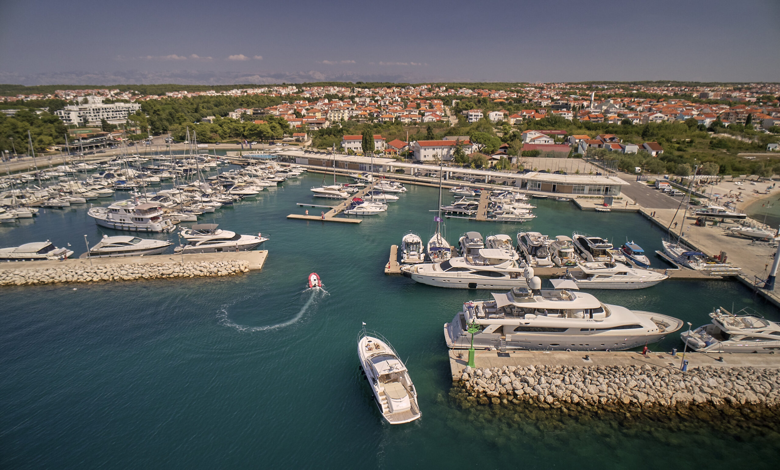 Aerial view of Marina Borik filled with yachts and boats along the Adriatic coast.