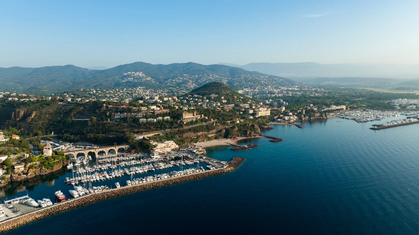 Aerial view of Château de la Napoule and the surrounding marina near Cannes on a sunny morning.