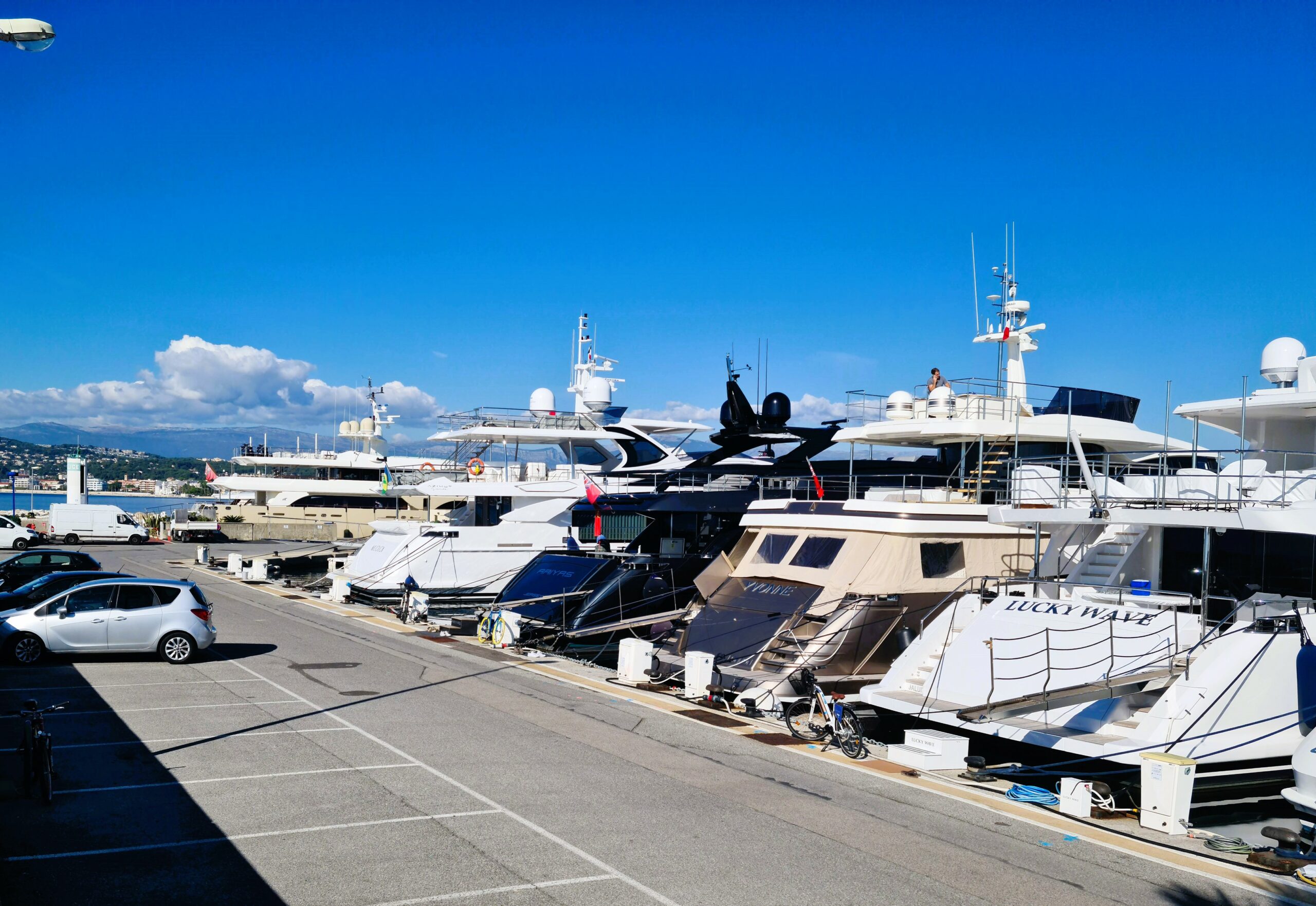 Luxury yachts docked at Port Gallice under a clear blue sky.